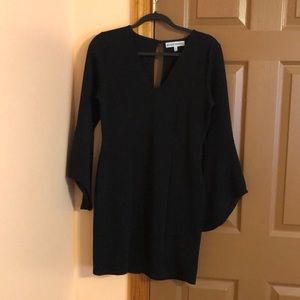 Black mini dress with winged sleeves